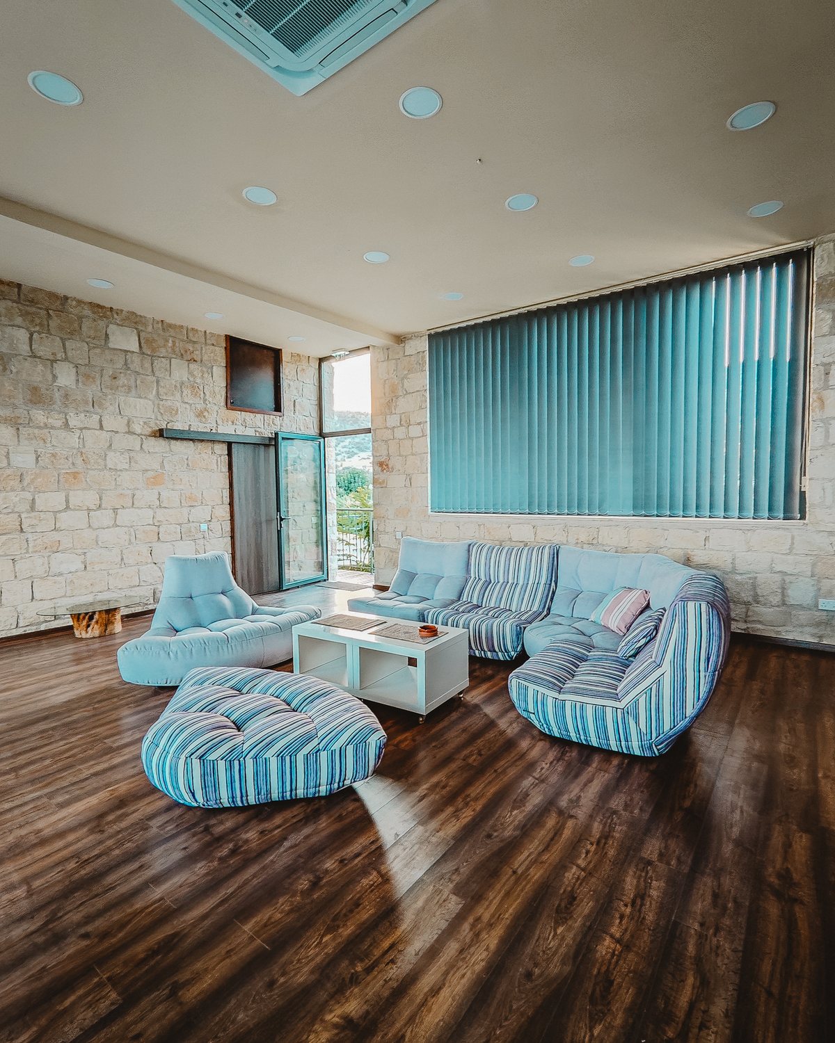 Open seminar hall at Kleos with natural light through arched windows