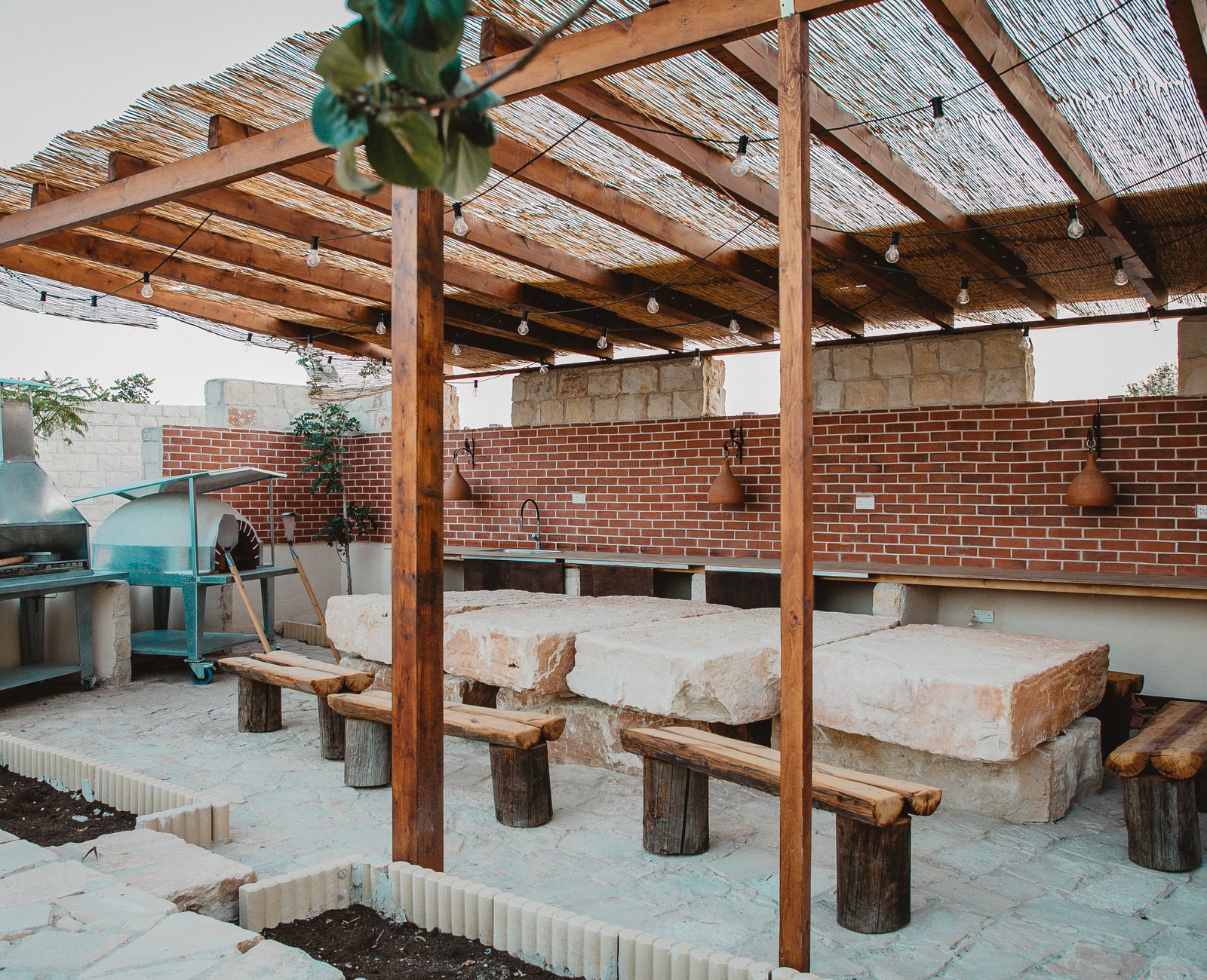 Wood oven and barbecue area under vines at Kleos